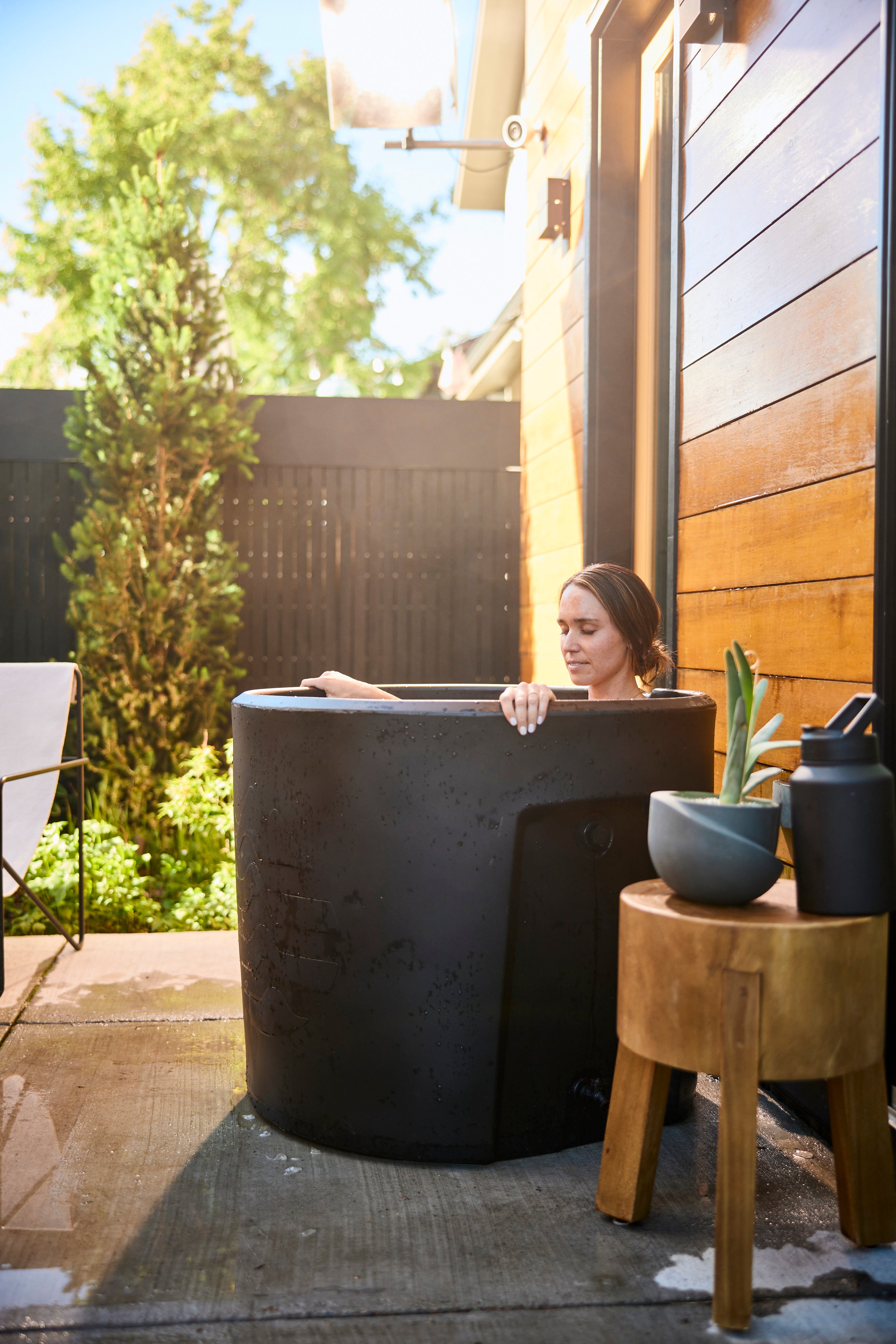 Woman sitting in Ice Barrel 300